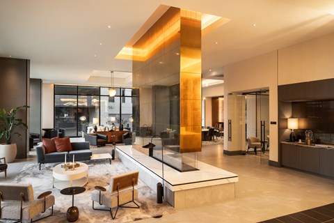 A modern living room with a large sectional sofa and a coffee table.
