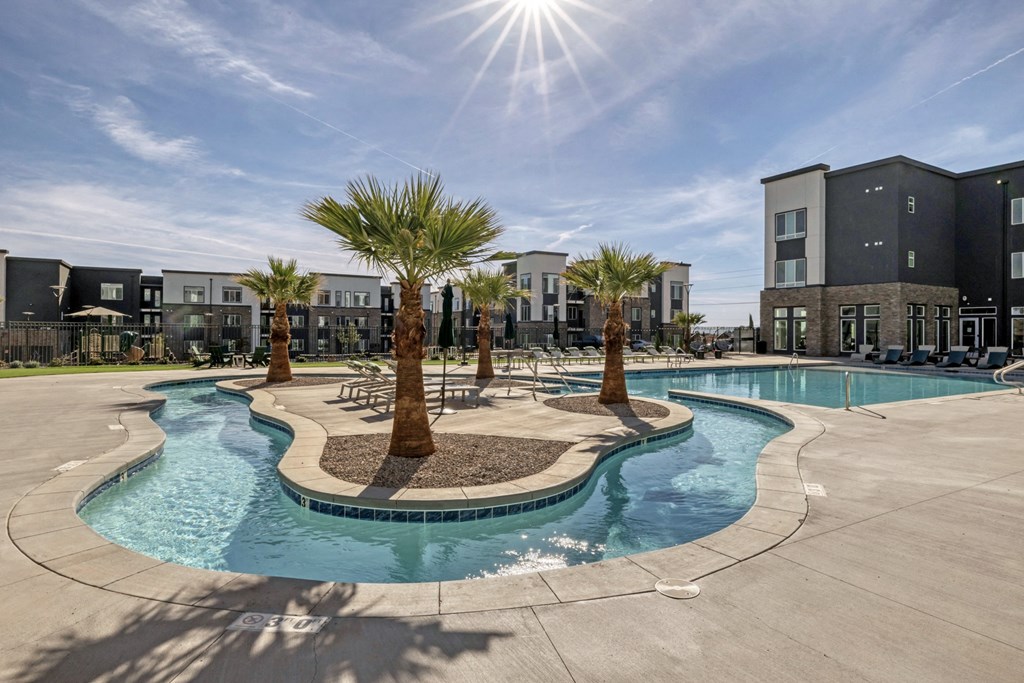 our apartments have a large swimming pool with palm trees