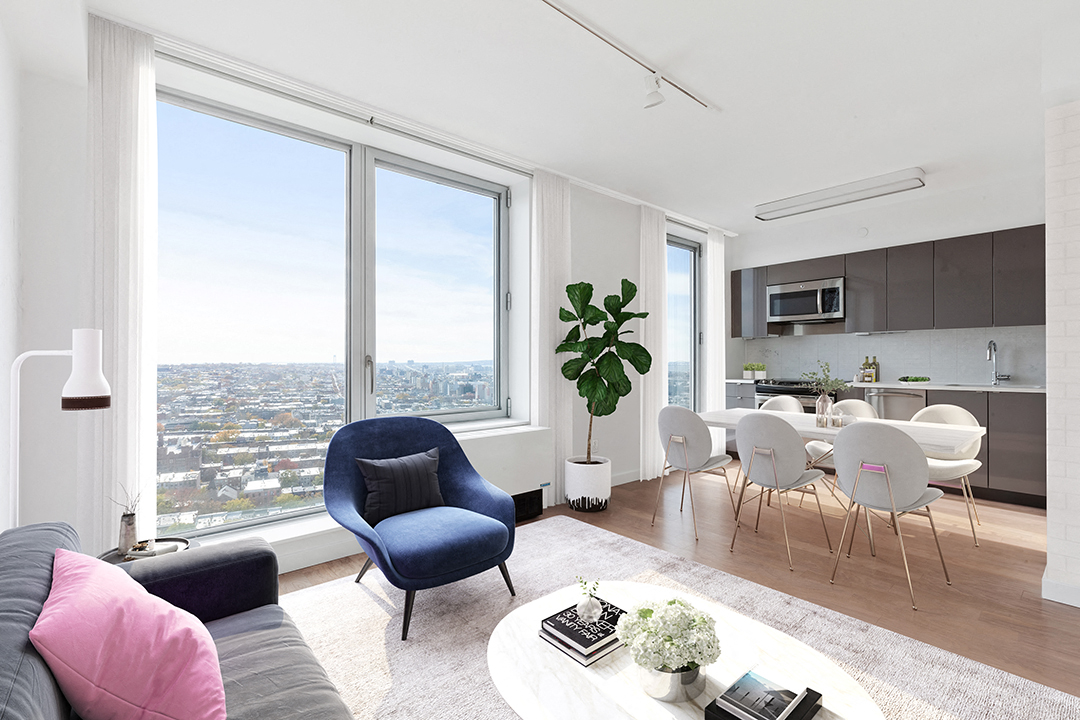 a living room with a table and chairs and a large window