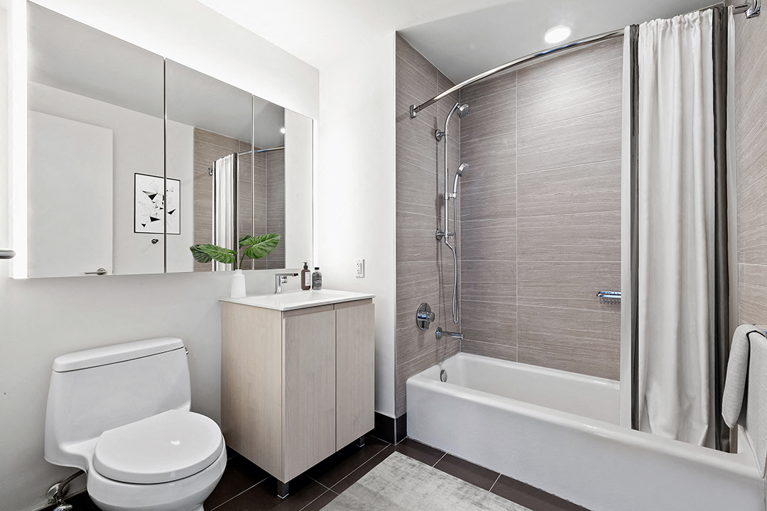 a bathroom with a toilet sink and shower