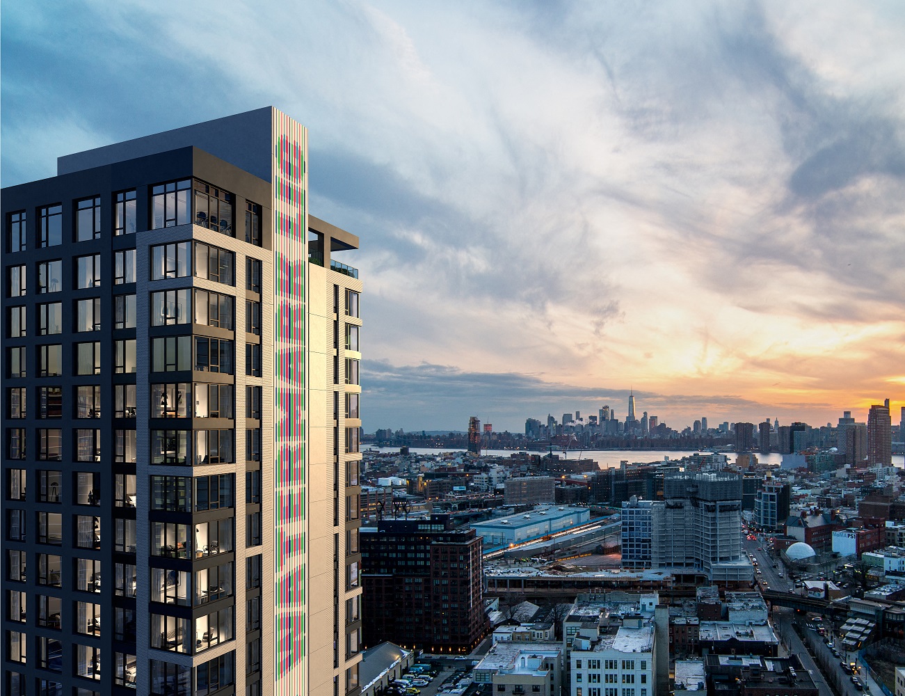 an aerial view of the city and the skyline at sunset