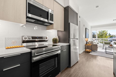 a kitchen with a stove and a microwave