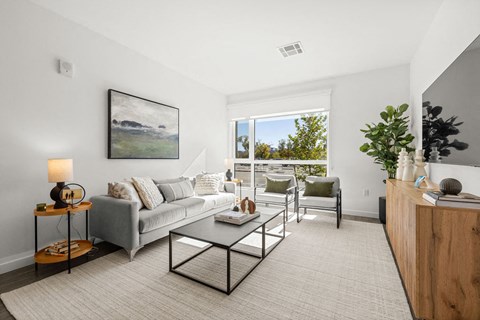 a living room with a couch and a table