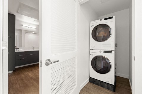a washer and dryer in a small closet in a room