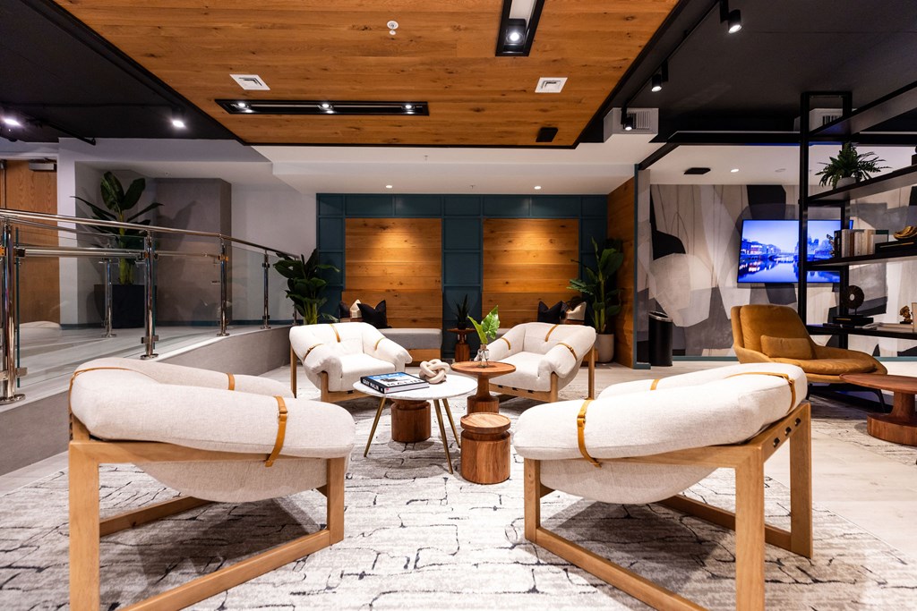 A room with a wooden floor and a white couch.