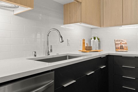 a kitchen with a sink and a faucet