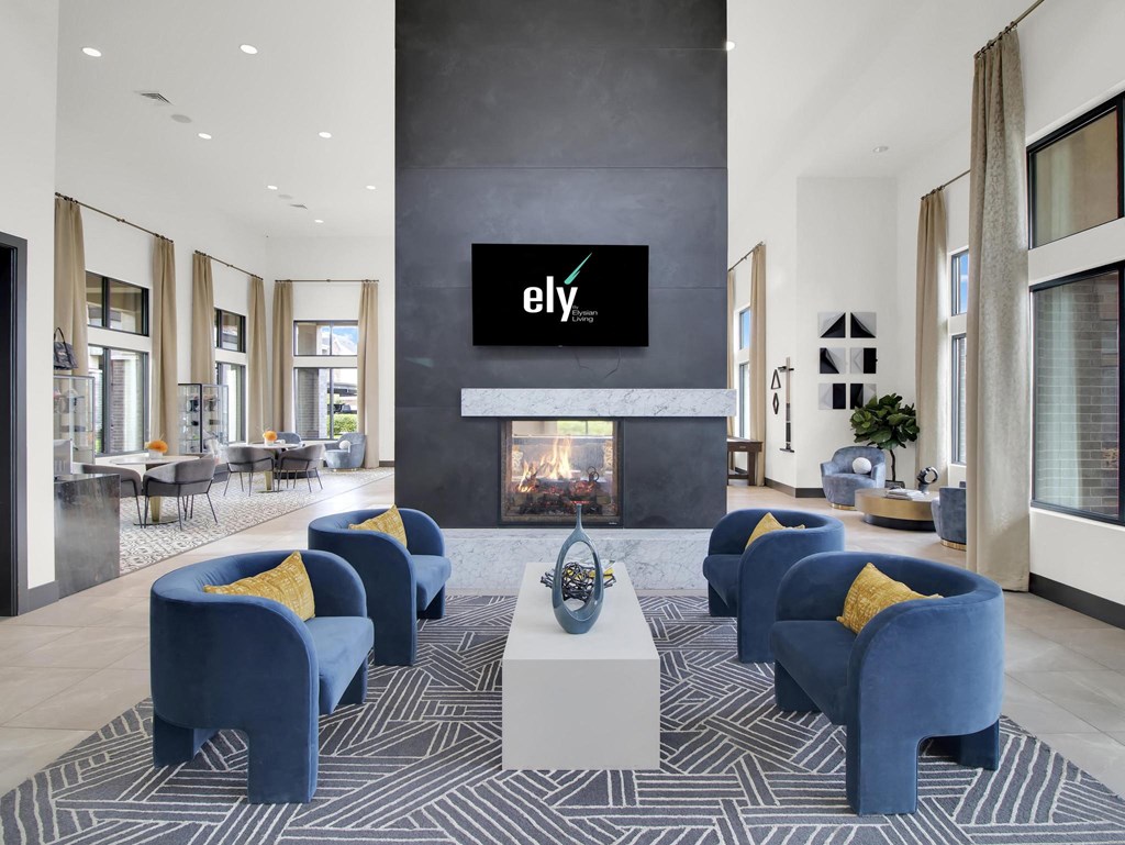 a room with a fireplace and a tv on the wall