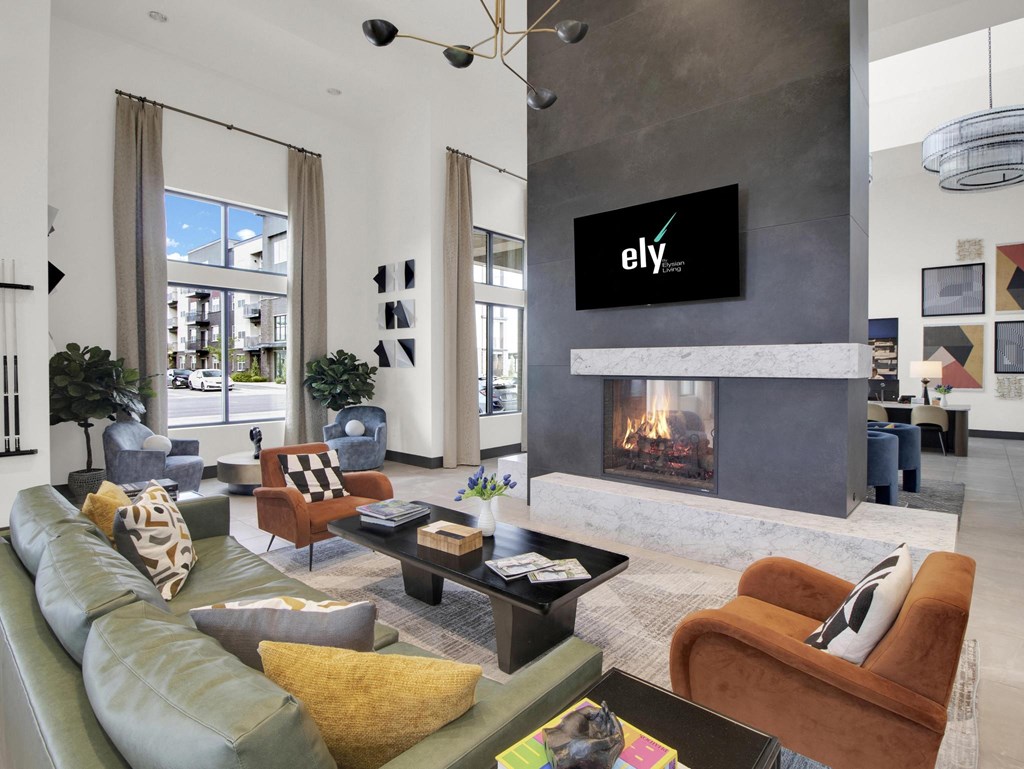 a living room with a fireplace and a flat screen tv on the wall