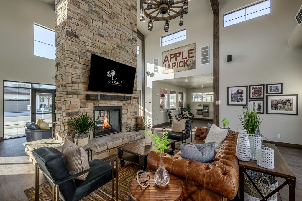 Clubhouse with couches and a fireplace