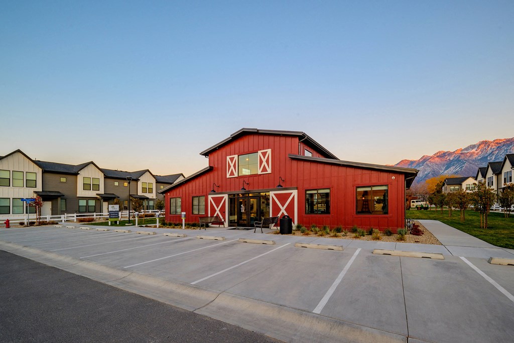red barn with the mountains in the background