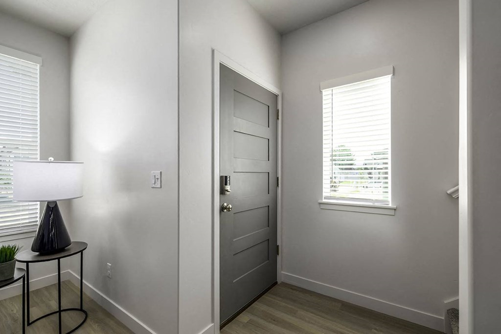 a bedroom with a door and a window