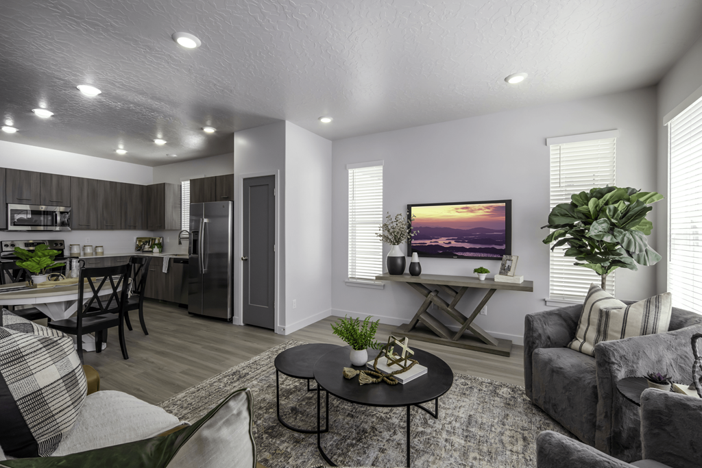 the living room of a home with a couch and a table