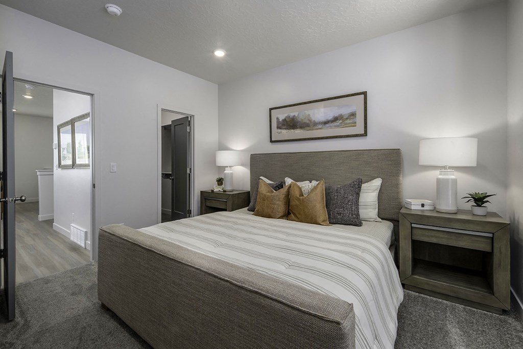 a bedroom with a large bed and a closet