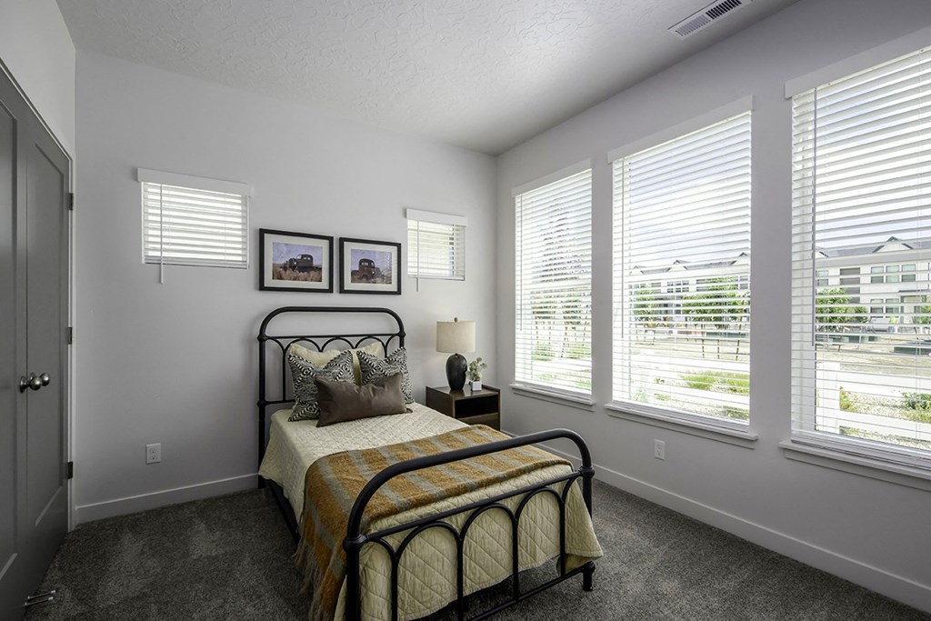 the preserve at ballantyne commons bedroom with bed and windows