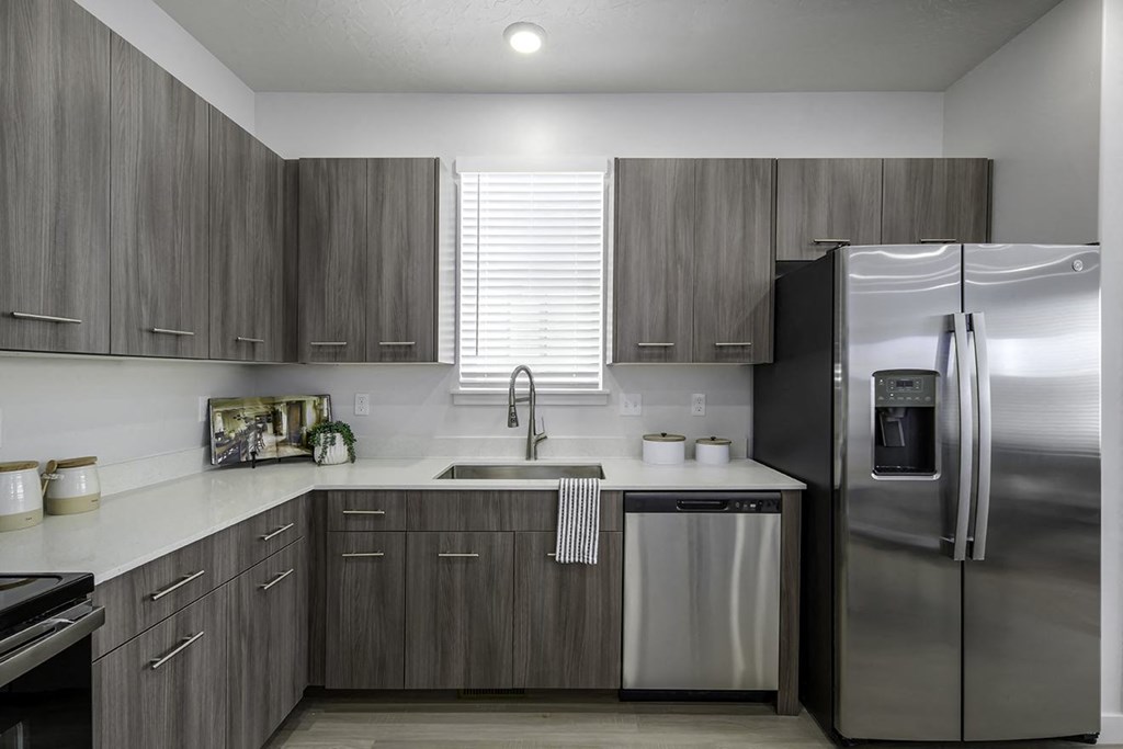 a kitchen with stainless steel appliances and a sink