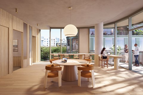 A modern dining room with a round table and chairs.
