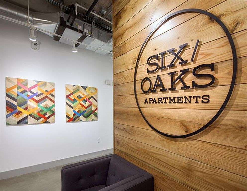 A wall with a sign that says