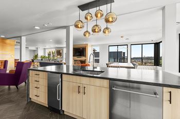 a kitchen with an island and a sink at Ion Town Center, Shoreline, WA 98133
