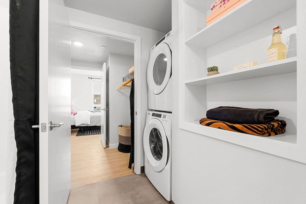 a small laundry room with a washer and dryer at Ion Town Center, Shoreline, WA