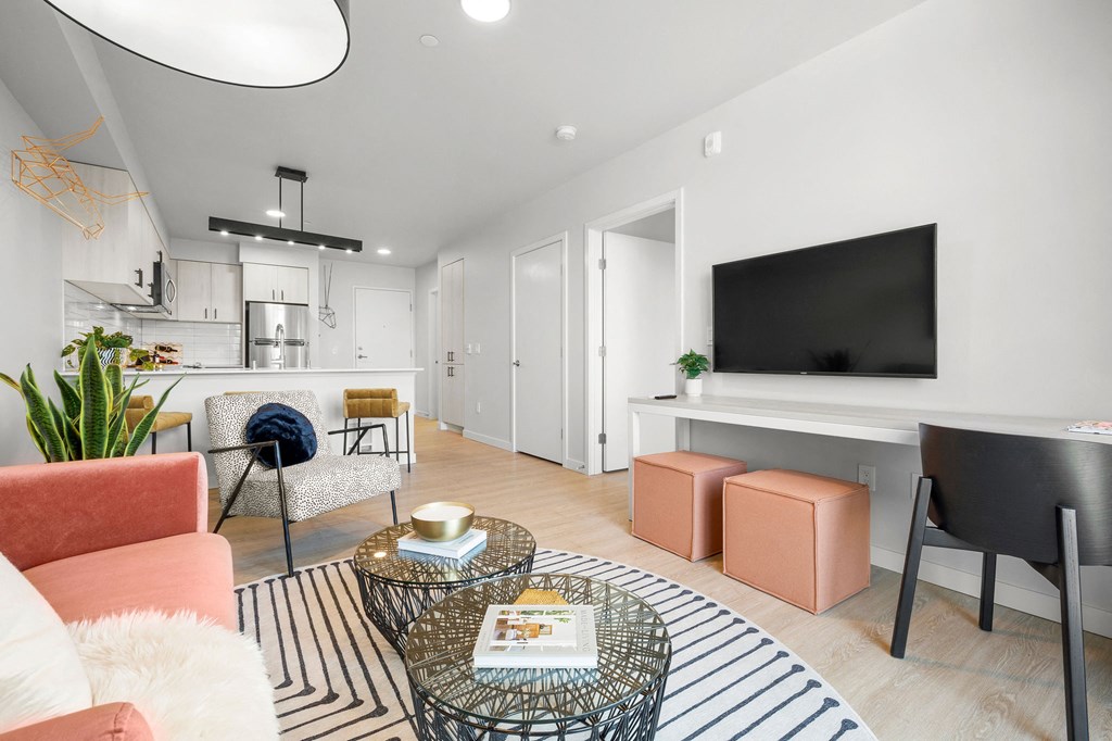 a living room with white walls and hardwood floors at Ion Town Center, Shoreline, WA 98133