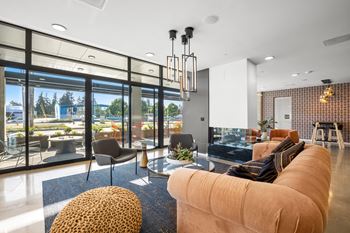 a living room filled with furniture and a large window at Ion Town Center, Shoreline