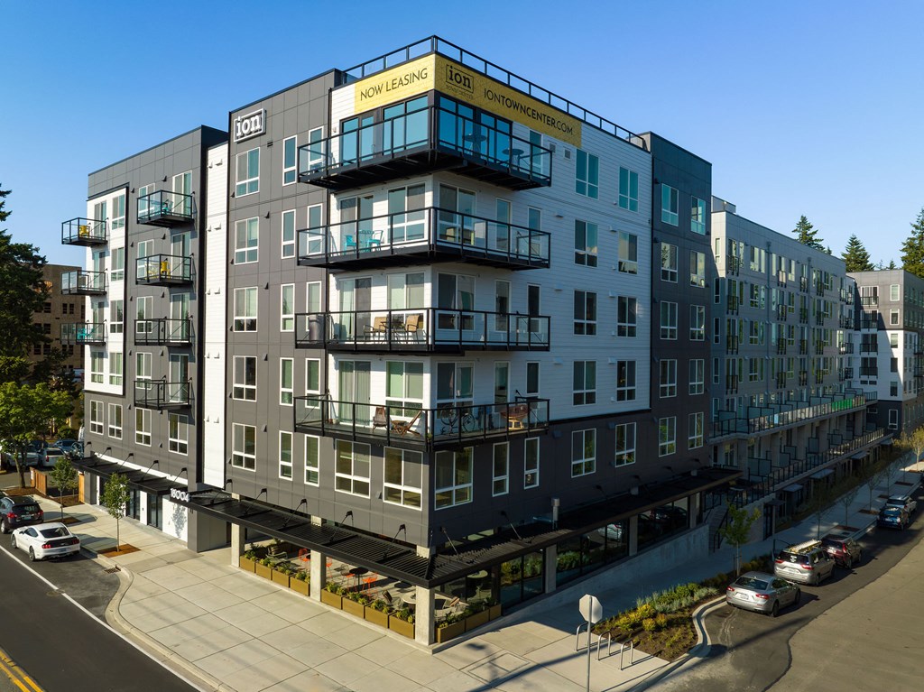 a rendering of a five story apartment building with balconies at Ion Town Center, Shoreline, WA 98133