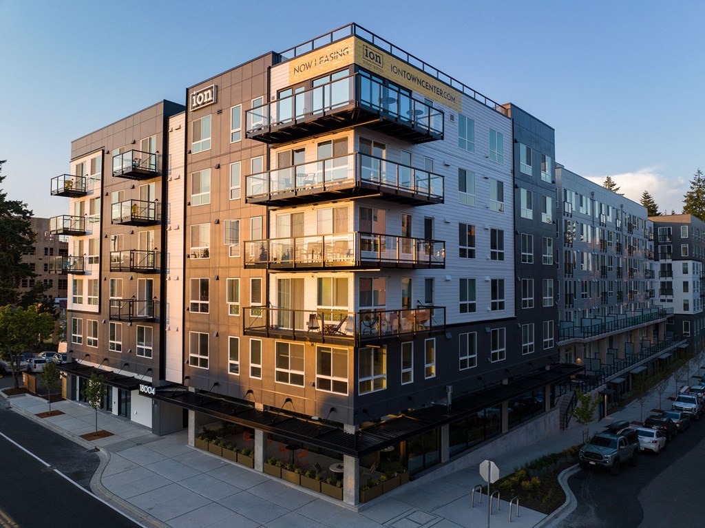 a rendering of a large apartment building with many balconies at Ion Town Center, Shoreline, WA