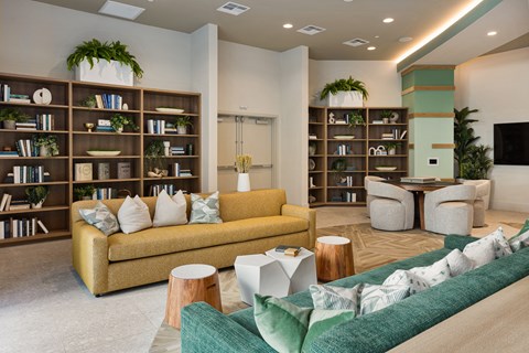 a living room with a couch and chairs and a table