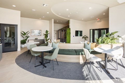 a living room with tables and chairs and a couch