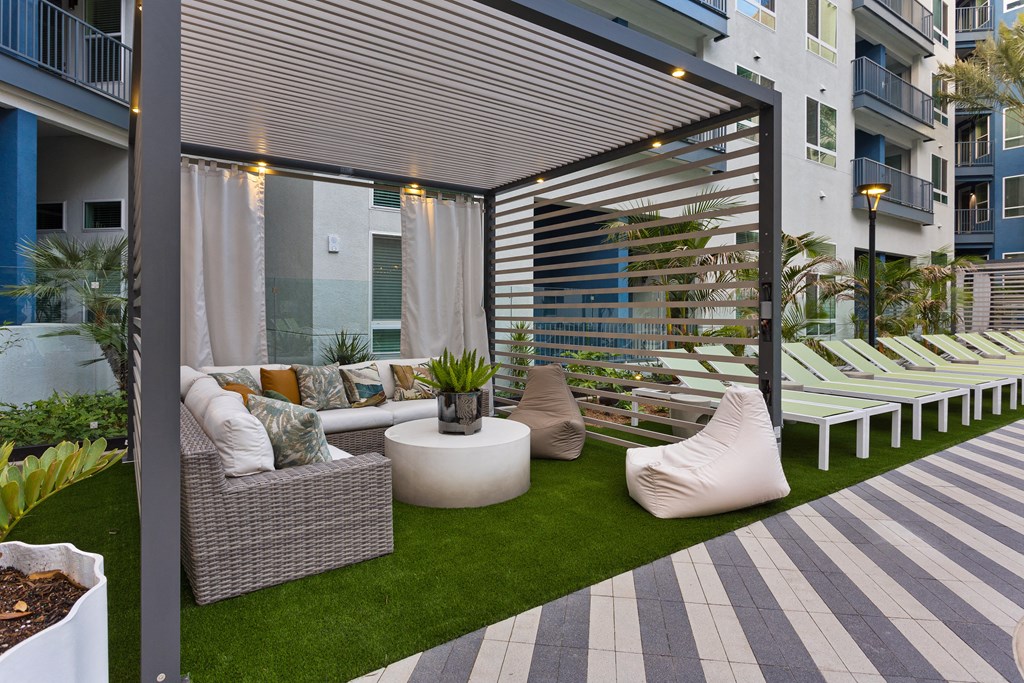 a patio with white furniture and a white table