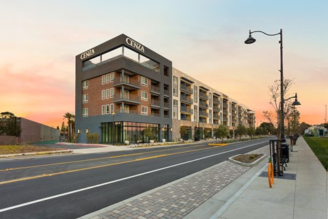 a rendering of an apartment building on a city street