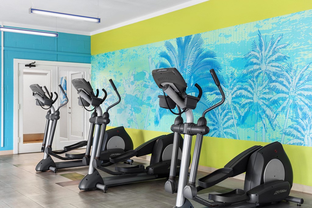 fitness center showing elliptical machines, 3.