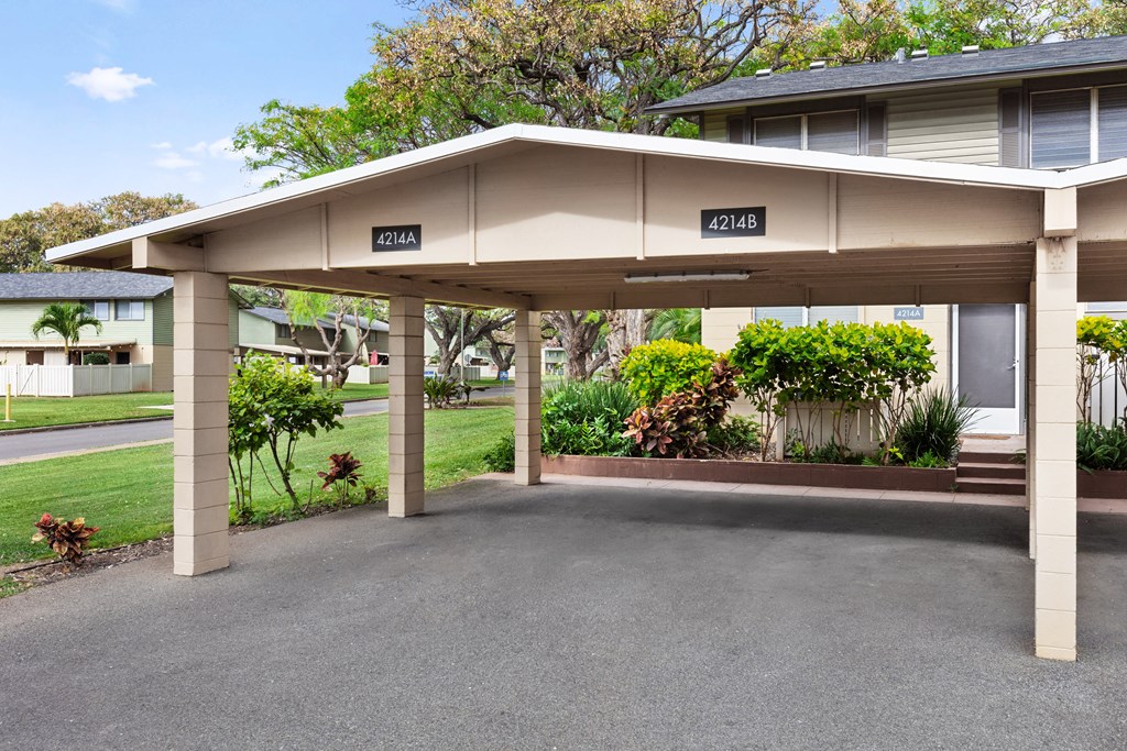 covered carport. Detached from building. 2 spots.