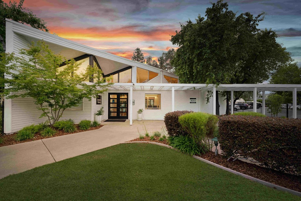 a house with white siding and a covered porch