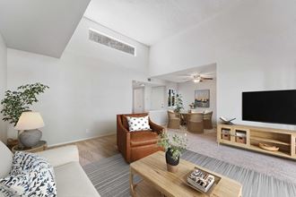 a living room with a couch and a coffee table - Photo Gallery