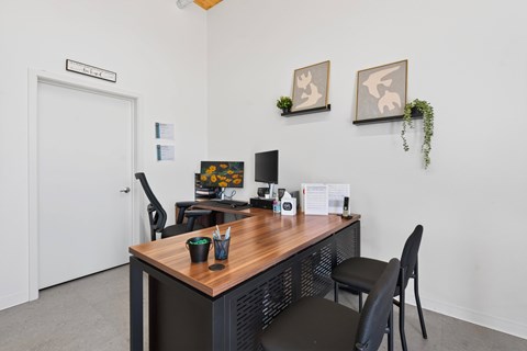 A room with a desk and a chair.