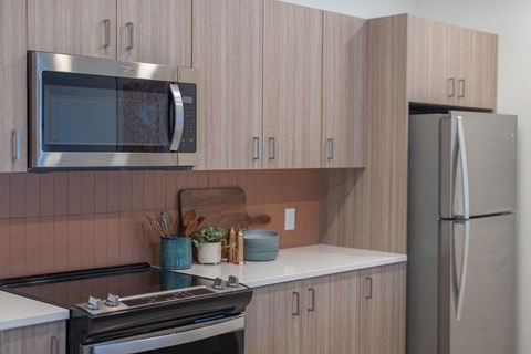 a kitchen with a stove and a microwave