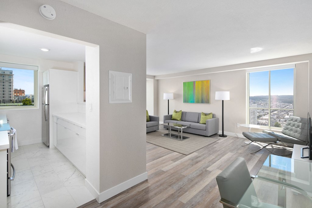 a living room with a couch a table and a chair