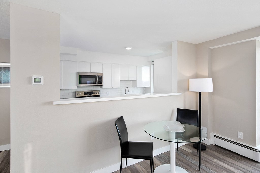 a kitchen and dining area in a 555 waverly unit