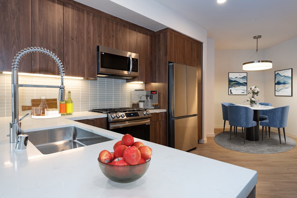 a kitchen and dining area in a 555 waverly unit