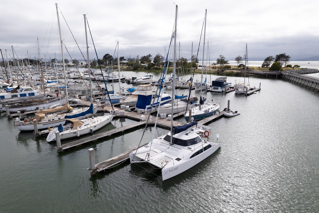 a marina filled with boats on a cloudy day