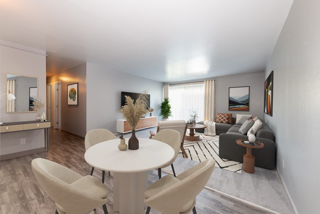 a living room with a white table and chairs