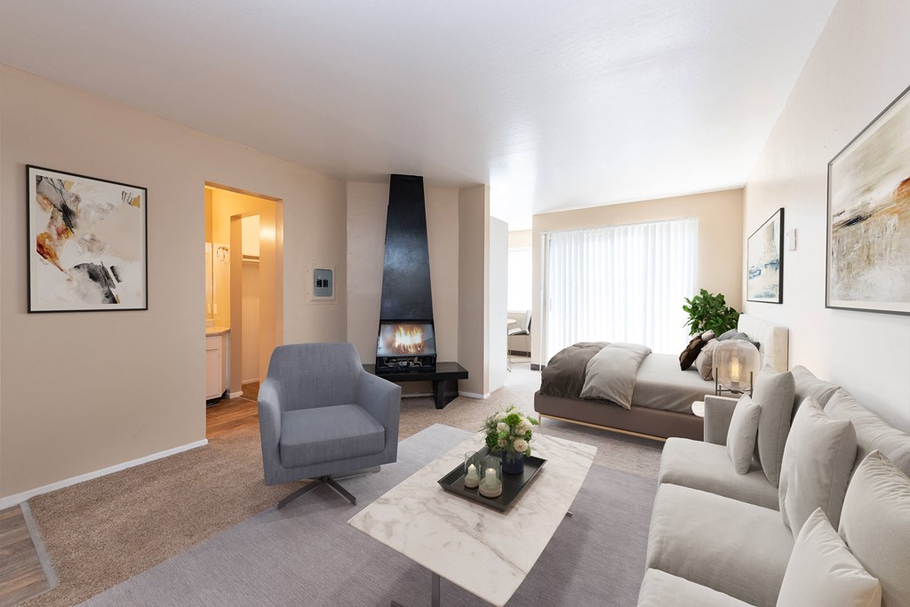 a living room filled with furniture and a fireplace