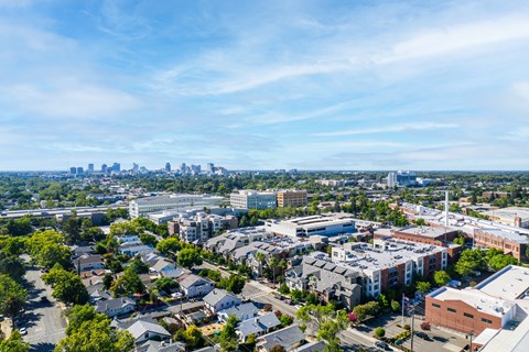 A cityscape with buildings and a clear sky.