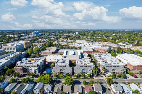 A cityscape with a mix of residential and commercial buildings.