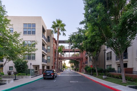A car is parked on the side of a street with a red line.