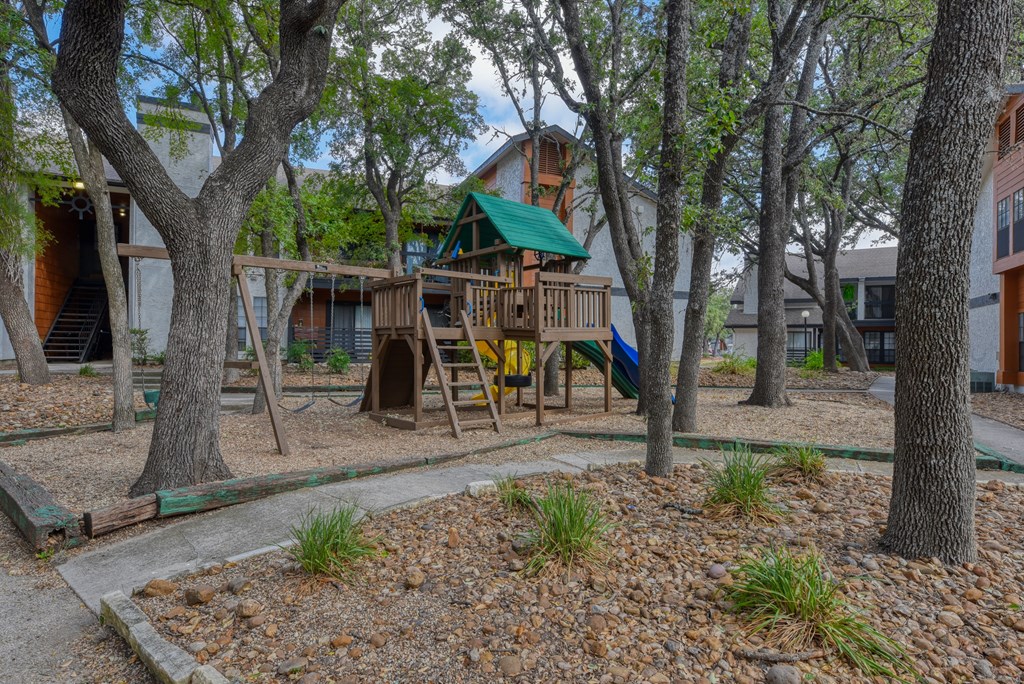 a playground at the whispering winds apartments in pearland, tx