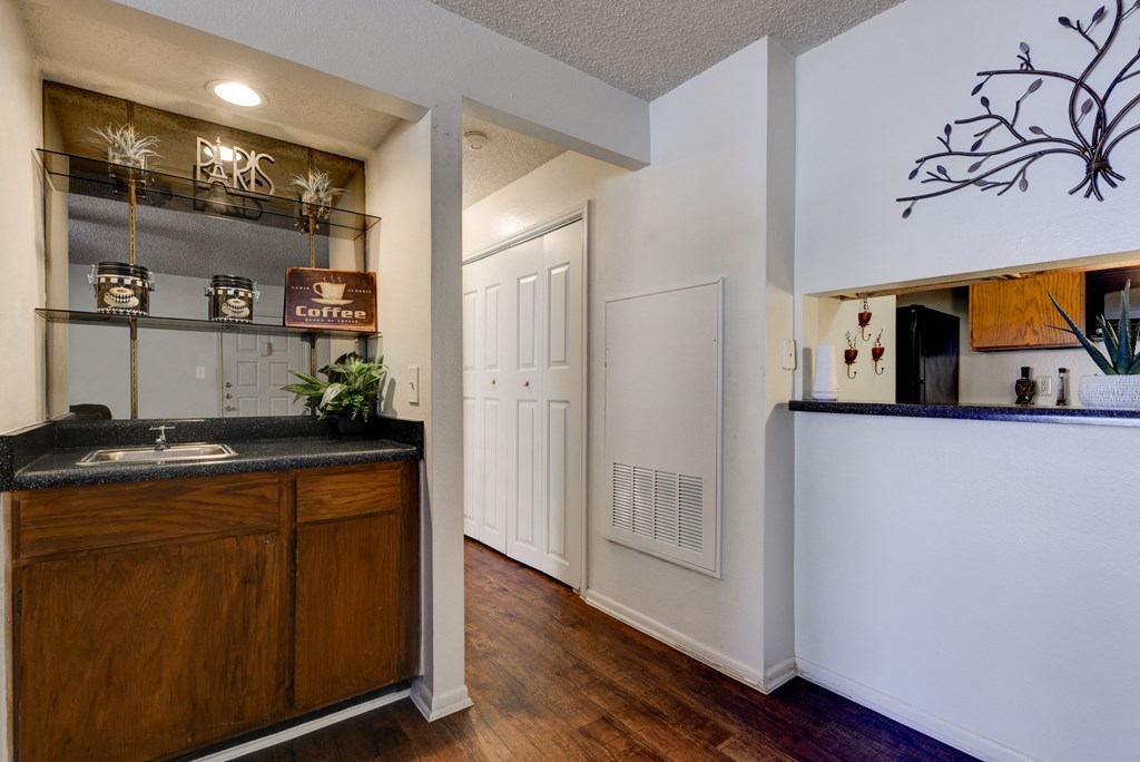a kitchen with a sink and a counter top