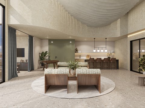 A modern living room with a circular wooden table and chairs.