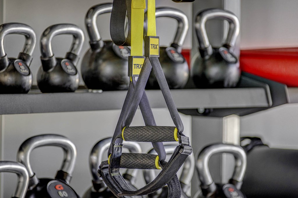a weight rack with kettlebells in the background